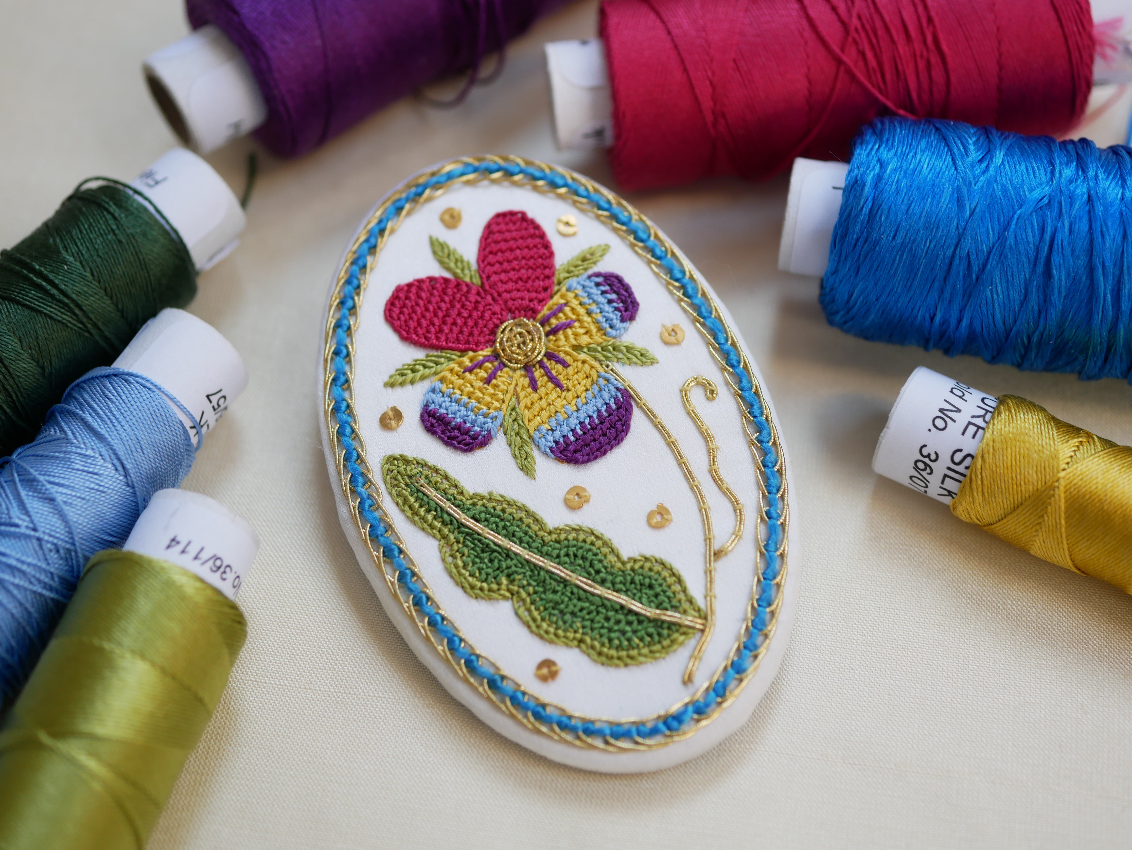 Elizabethan-inspired Pansy embroidery designed and stitched by Kate Barlow using silk threads, Goldwork and Needlelace techniques