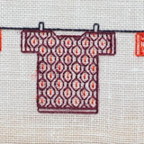 T-Shirts on a Washing Line by Claire De Waard