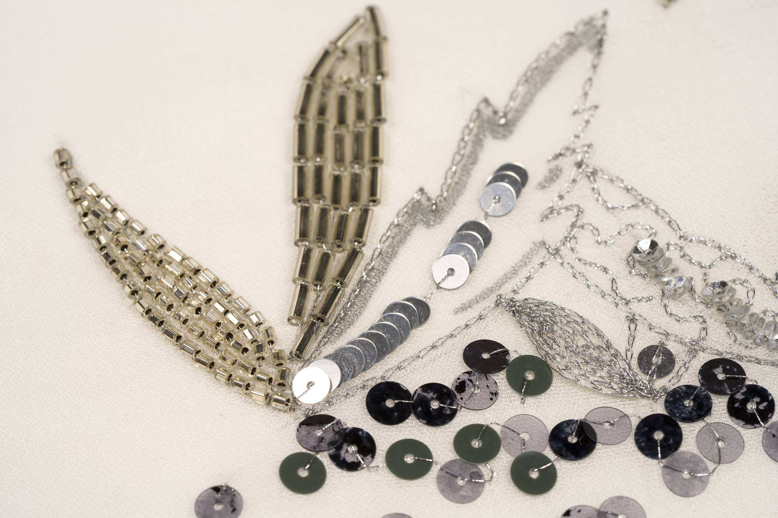 Tambour Beading eye design with sequin and bead embroidery, designed and stitched by Justine Bonenfant as a contemporary introduction to Couture Embroidery.