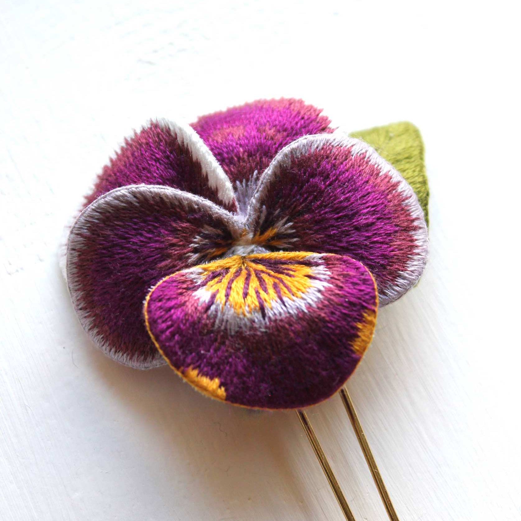 Hand embroidered Viola Hairpin with Silk Shading embroidery transitioning from yellow to purple, stitched by Pippa Haynes.